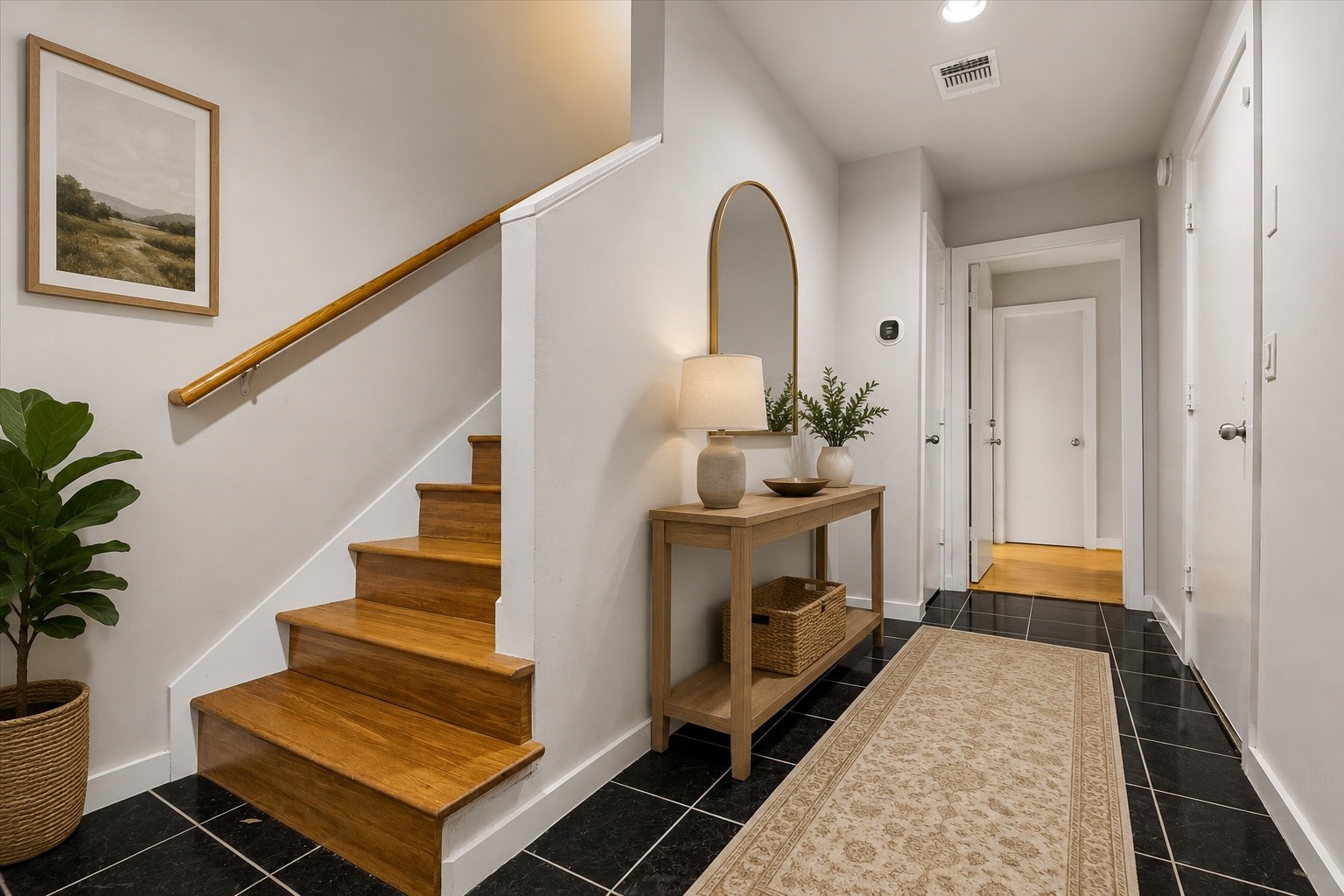 939 Colorado Street, Unit 22 Houston, TX 77007 - Photo 10 of 23 a view of a hallway with wooden floor and staircase