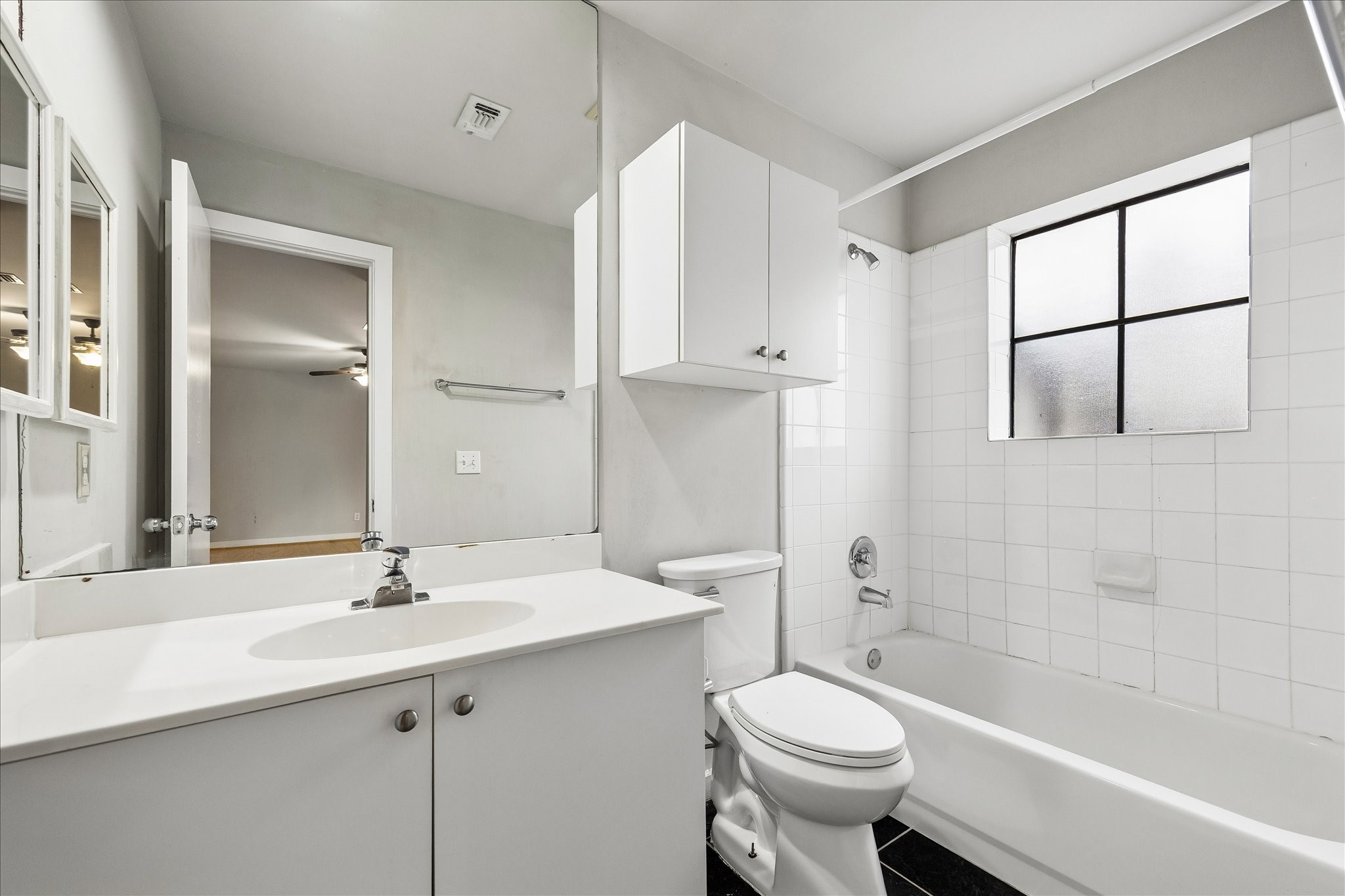 939 Colorado Street, Unit 22 Houston, TX 77007 - Photo 16 of 23 a bathroom with a sink a toilet and shower