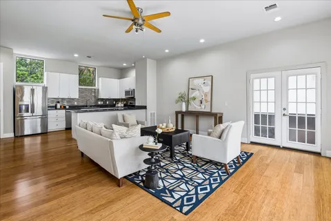 a view of a dining room with furniture and wooden floor