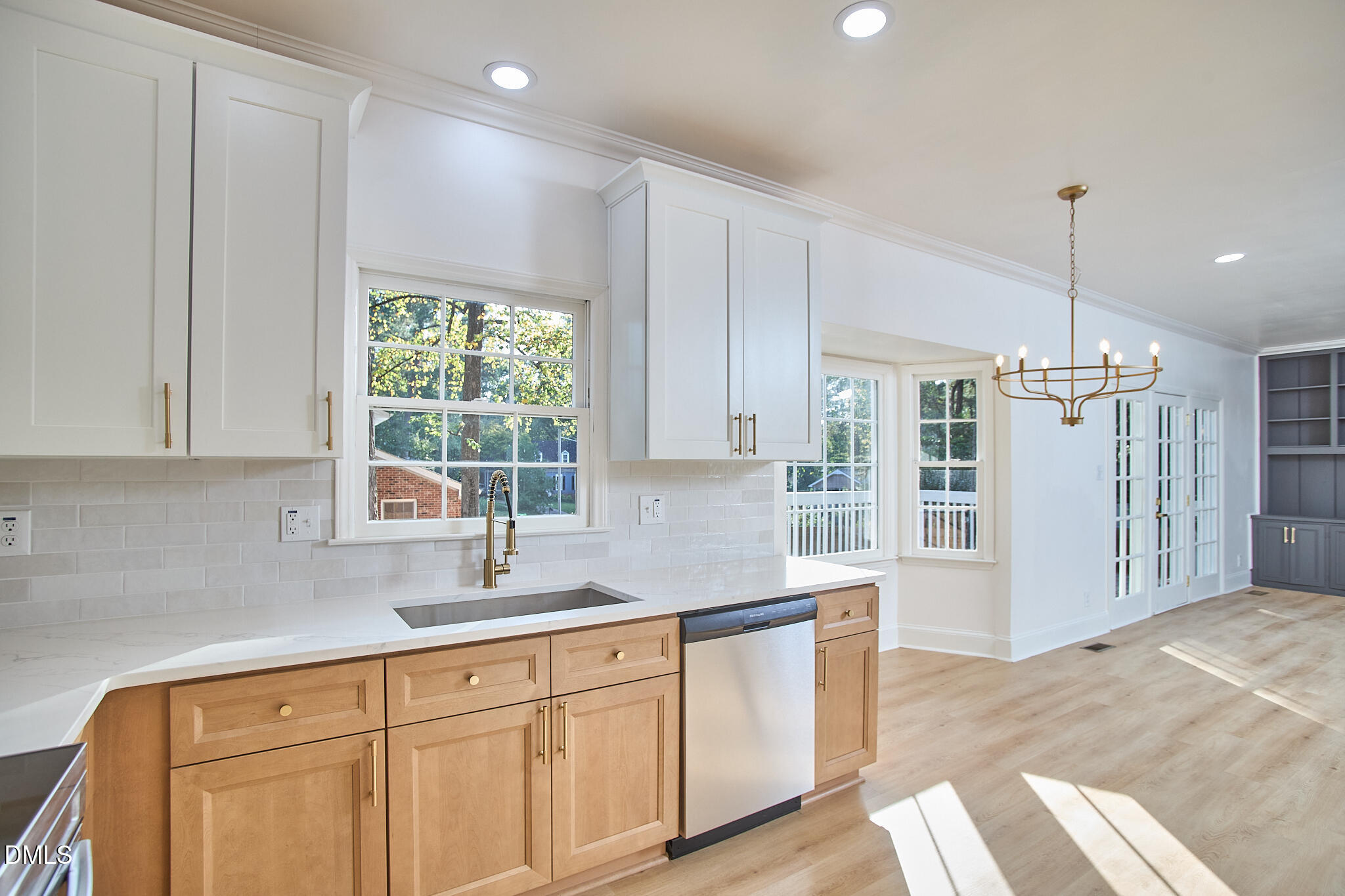 5721 Timber Ridge Drive Raleigh, NC 27609 - Photo 9 of 76 a kitchen with stainless steel appliances granite countertop a sink a window and a refrigerator