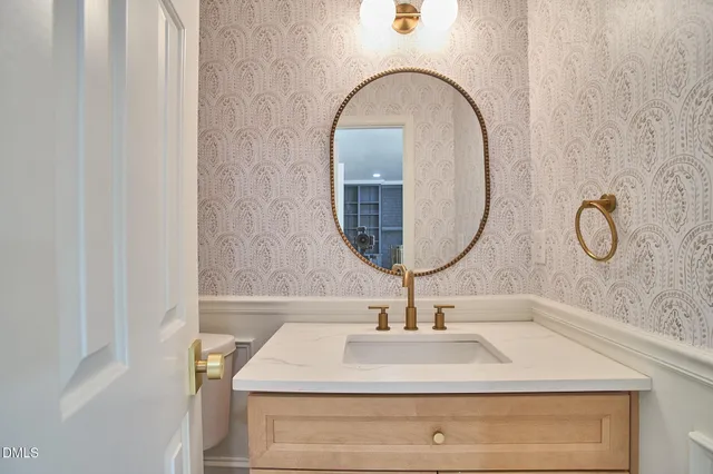 a view of a hallway with wooden floor and entryway