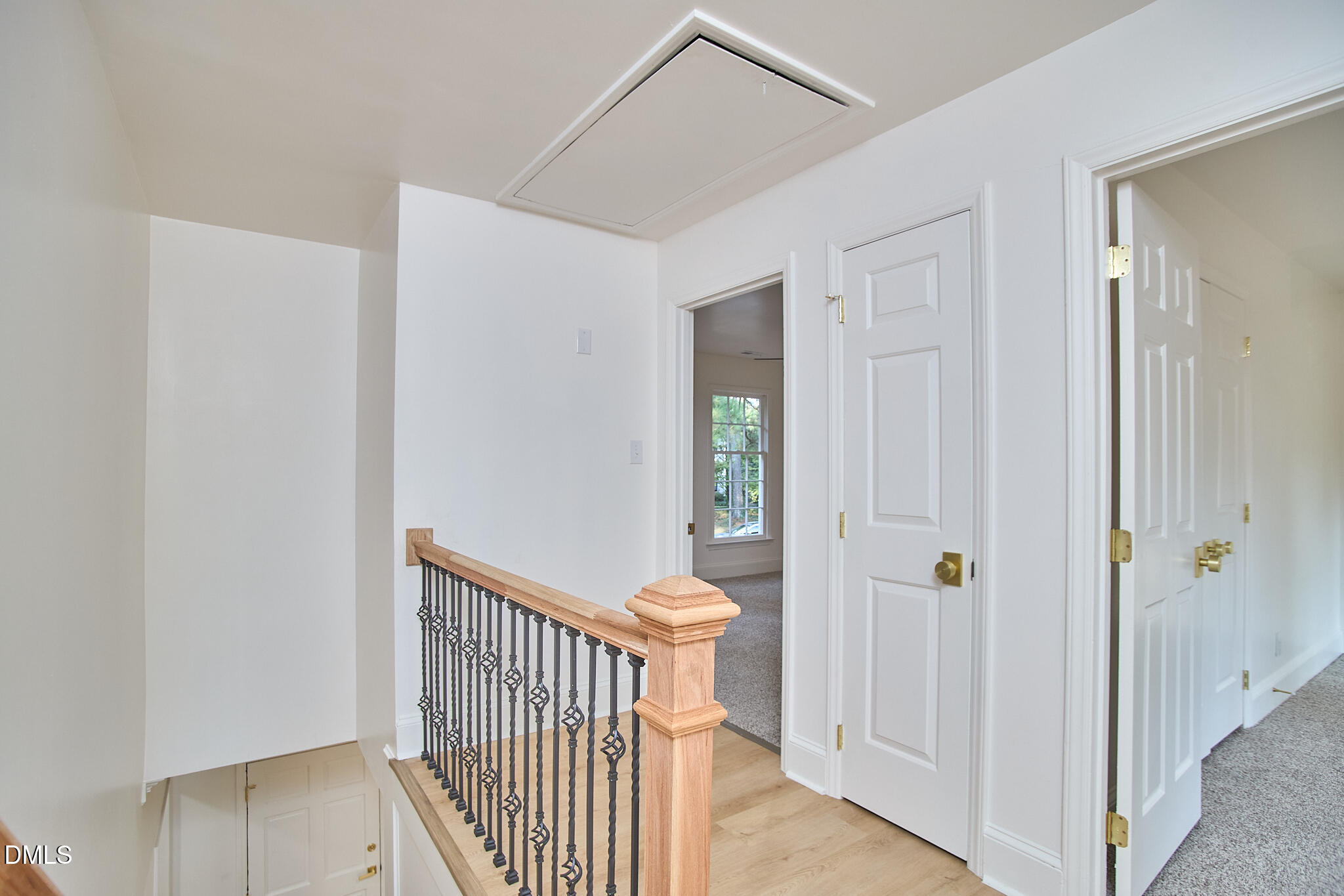 5721 Timber Ridge Drive Raleigh, NC 27609 - Photo 11 of 76 a view of a hallway with wooden floor and entryway