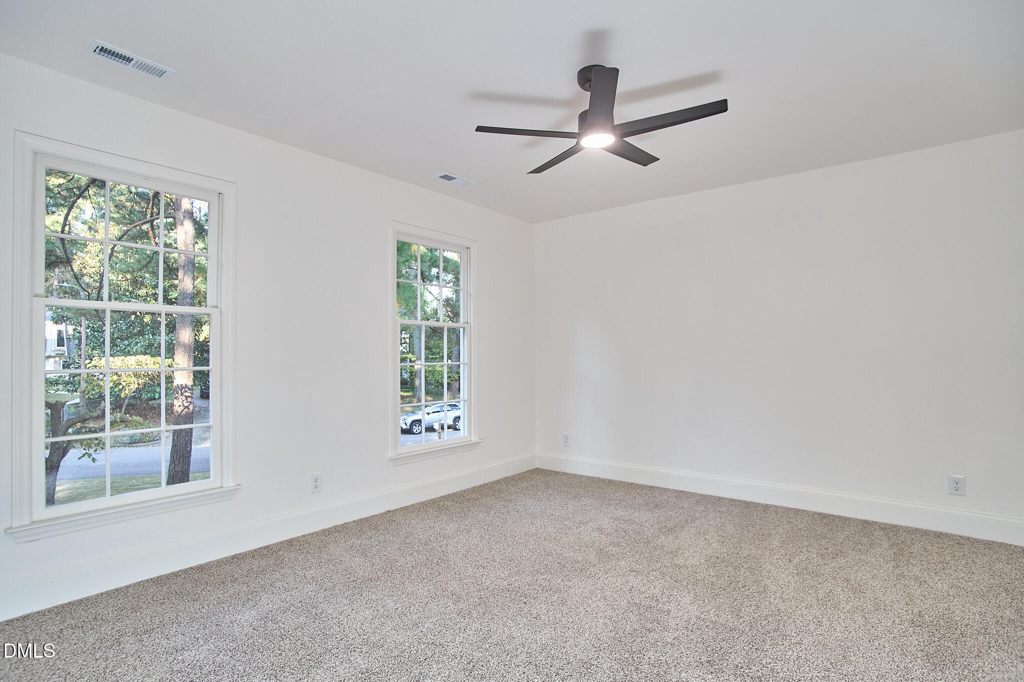 5721 Timber Ridge Drive Raleigh, NC 27609 - Photo 21 of 76 a view of a livingroom with a ceiling fan and window