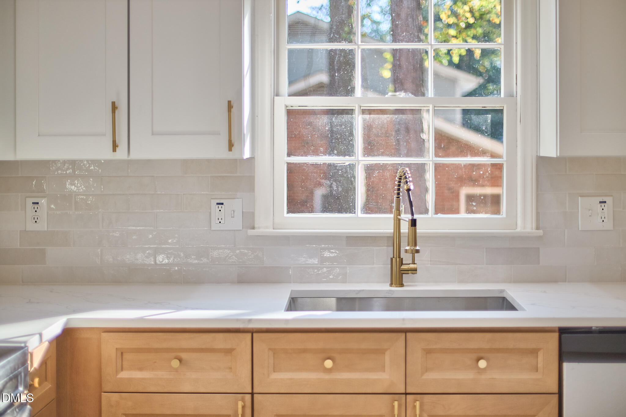 5721 Timber Ridge Drive Raleigh, NC 27609 - Photo 22 of 76 a kitchen with a white cabinets and a potted plant