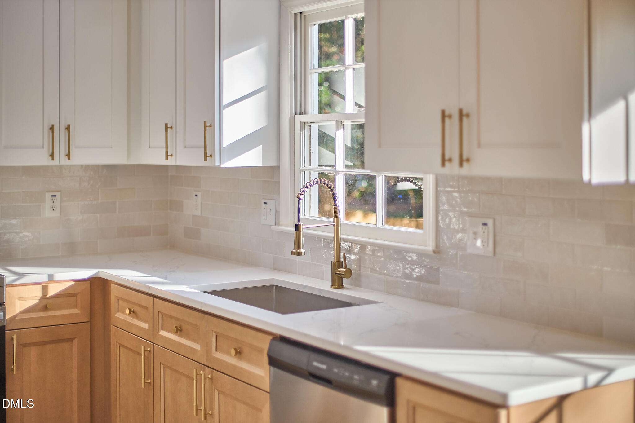 5721 Timber Ridge Drive Raleigh, NC 27609 - Photo 23 of 76 a kitchen with a sink and a cabinets
