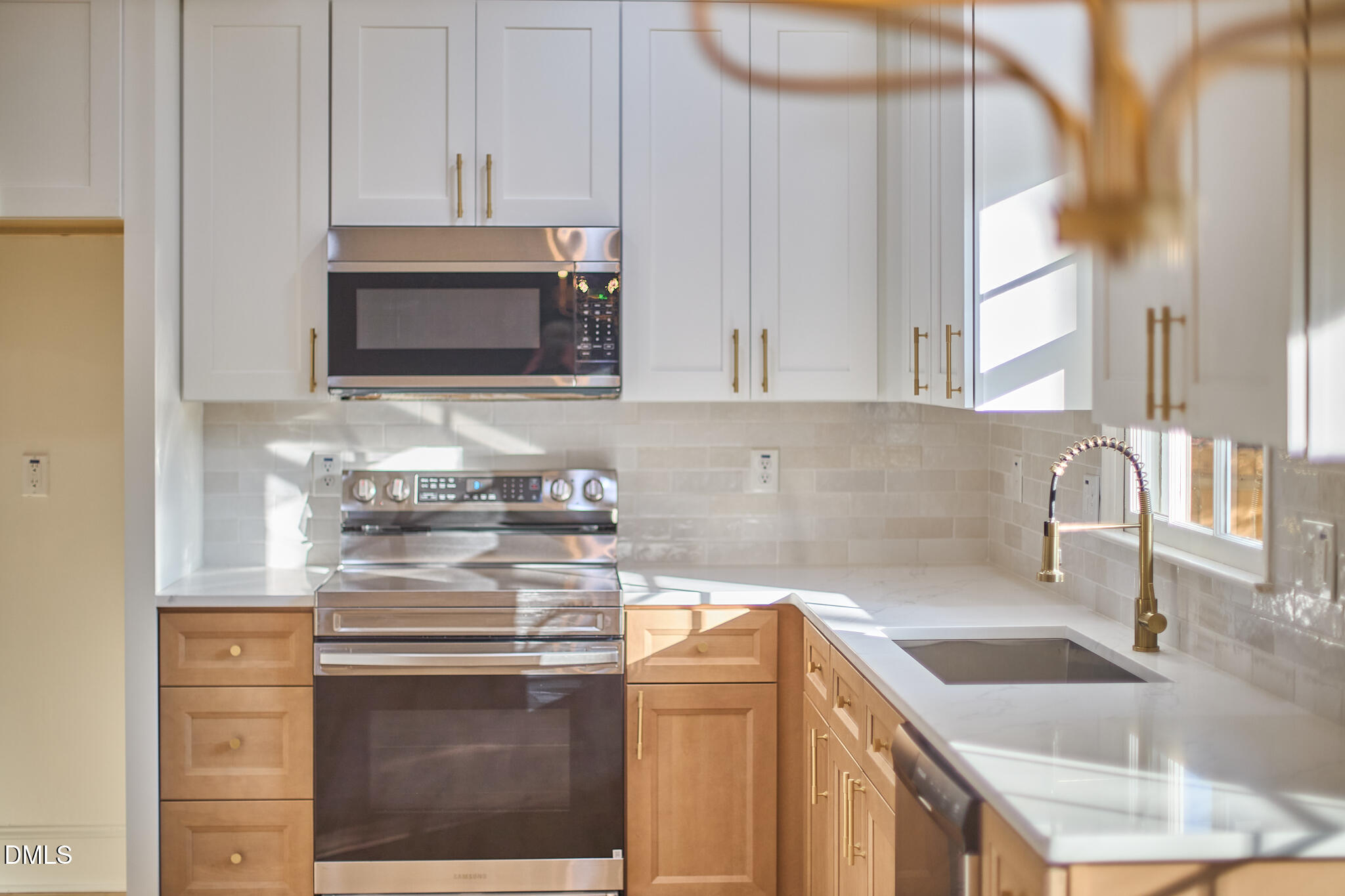 5721 Timber Ridge Drive Raleigh, NC 27609 - Photo 24 of 76 a kitchen with stainless steel appliances granite countertop a sink stove and microwave