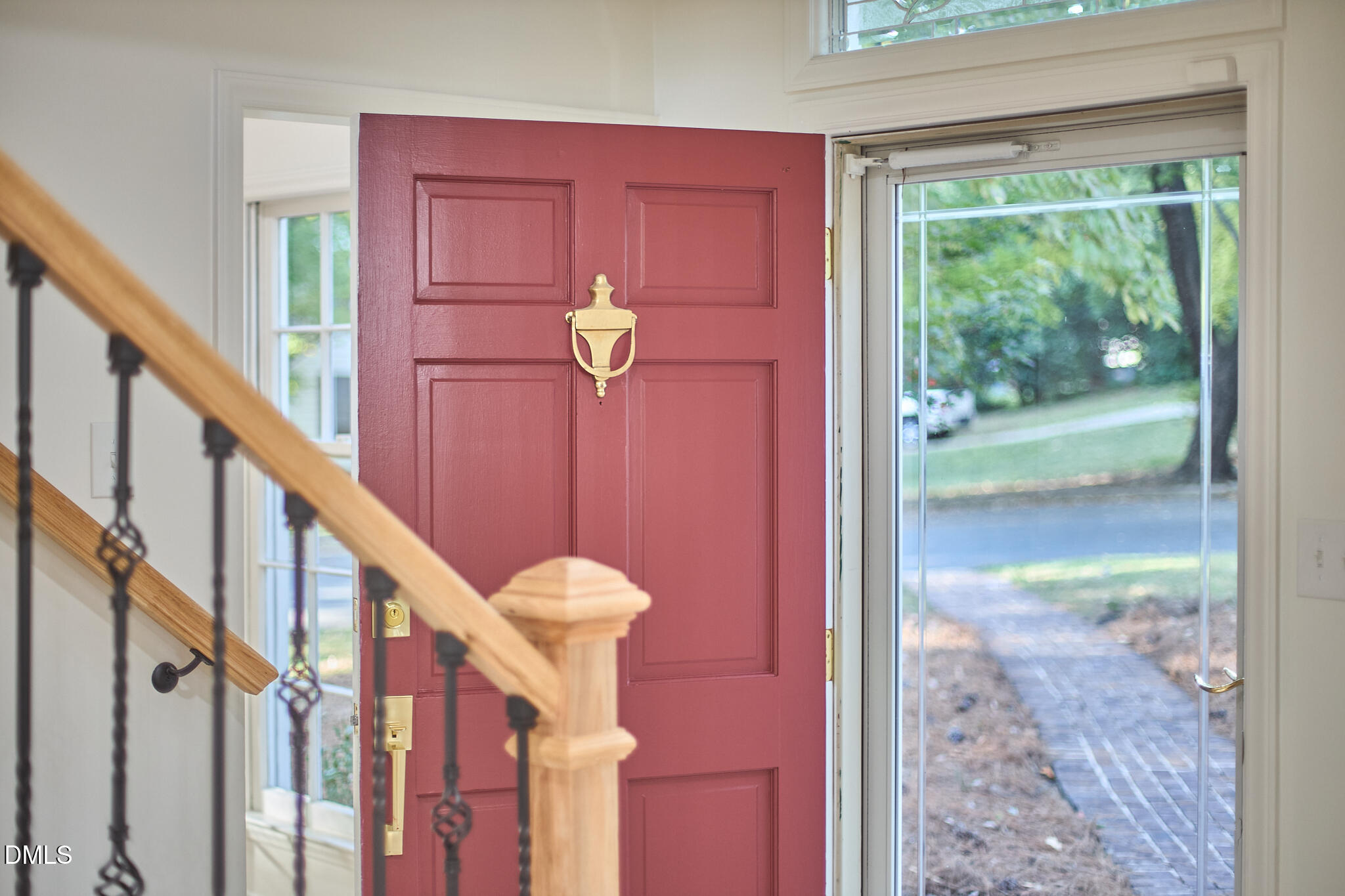 5721 Timber Ridge Drive Raleigh, NC 27609 - Photo 29 of 76 a view of a hallway with wooden floor and staircase
