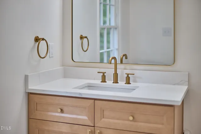 a front view of a house with a yard in front of it