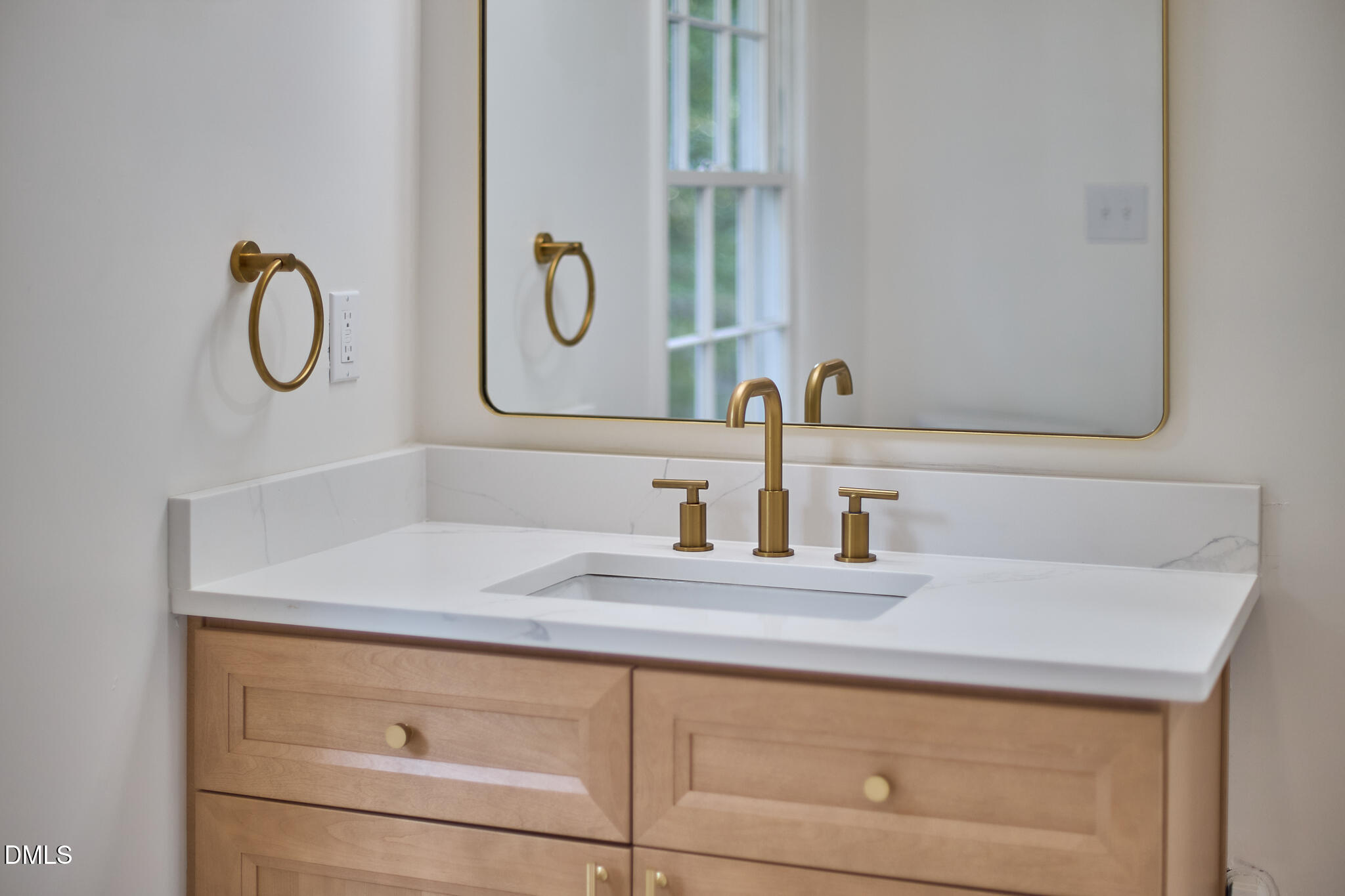 5721 Timber Ridge Drive Raleigh, NC 27609 - Photo 33 of 76 a bathroom with a sink and a mirror
