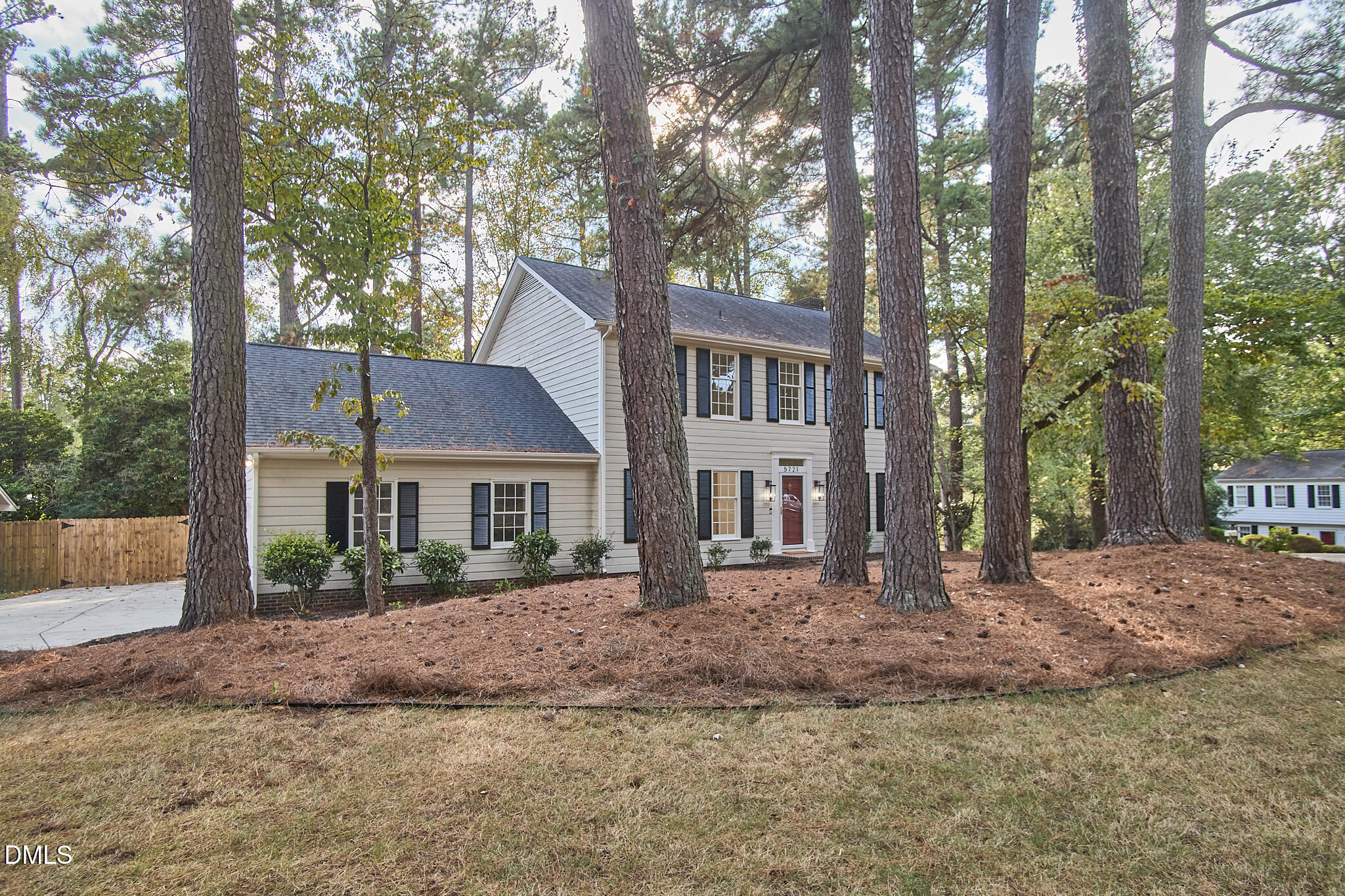 5721 Timber Ridge Drive Raleigh, NC 27609 - Photo 38 of 76 a front view of a house with a garden