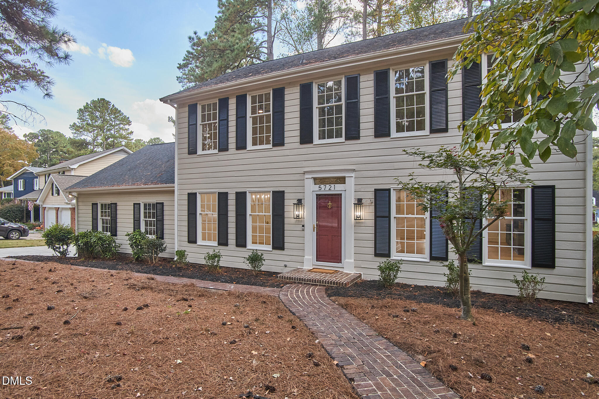 5721 Timber Ridge Drive Raleigh, NC 27609 - Photo 40 of 76 a front view of a house with a yard in front of it