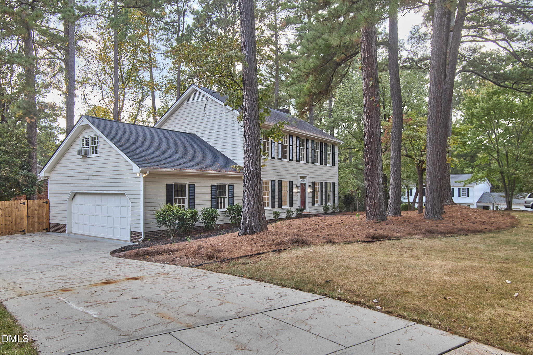 5721 Timber Ridge Drive Raleigh, NC 27609 - Photo 42 of 76 a view of a house with a yard and large trees