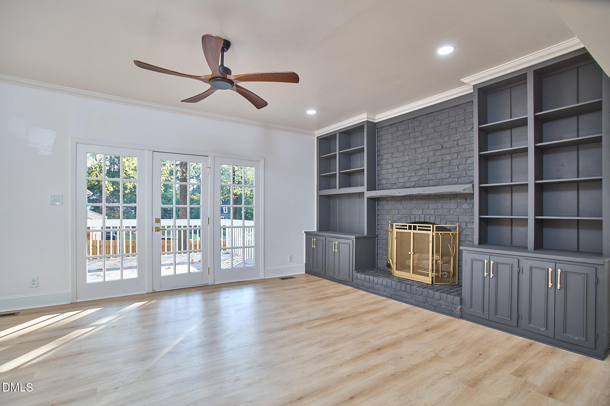 5721 Timber Ridge Drive Raleigh, NC 27609 - Photo 59 of 76 a view of empty room with wooden floor and fan