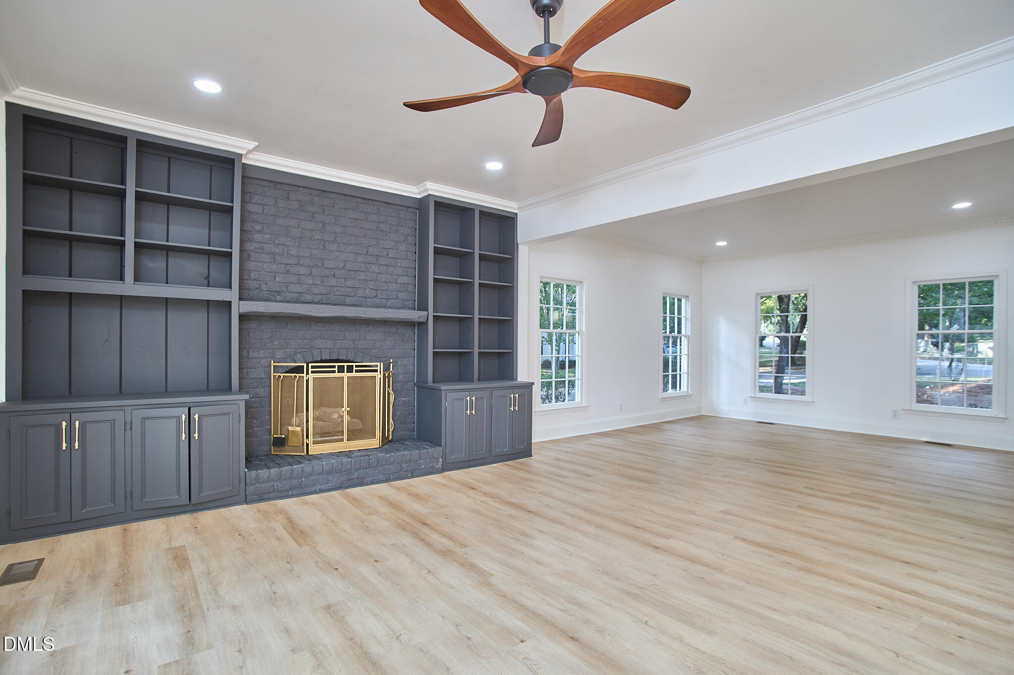 5721 Timber Ridge Drive Raleigh, NC 27609 - Photo 61 of 76 a view of an empty room with a window and a kitchen