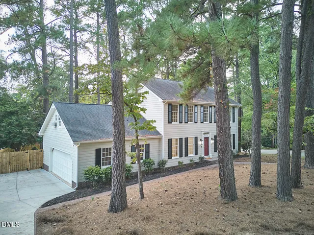 a kitchen with granite countertop cabinets stainless steel appliances and a sink