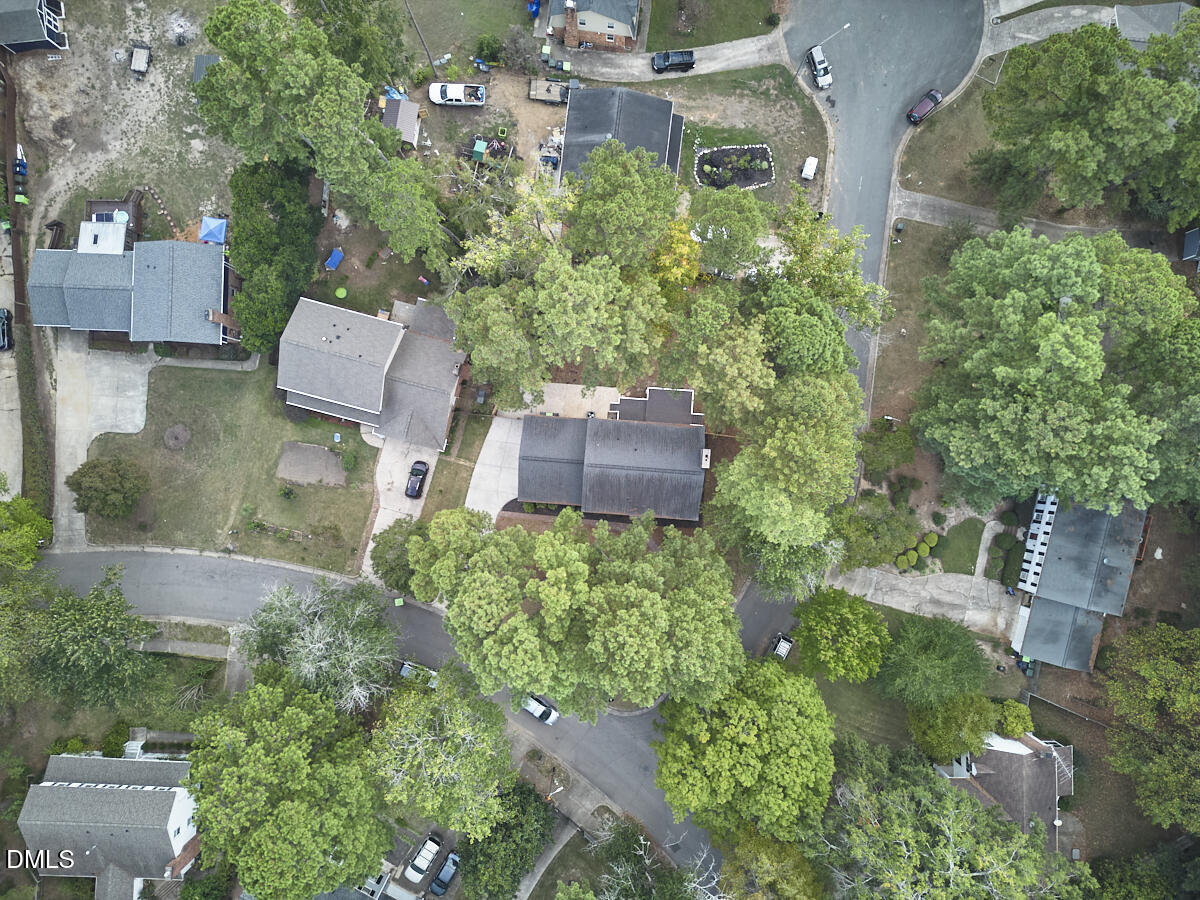 5721 Timber Ridge Drive Raleigh, NC 27609 - Photo 69 of 76 an aerial view of residential house with outdoor space and trees all around
