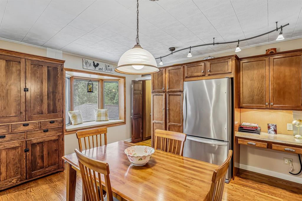529 Utopia Road Apollo, PA 15613 - Photo 16 of 50 a kitchen with stainless steel appliances granite countertop a refrigerator a oven a sink with a dining table and chairs