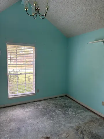 a view of a room that has a window in it