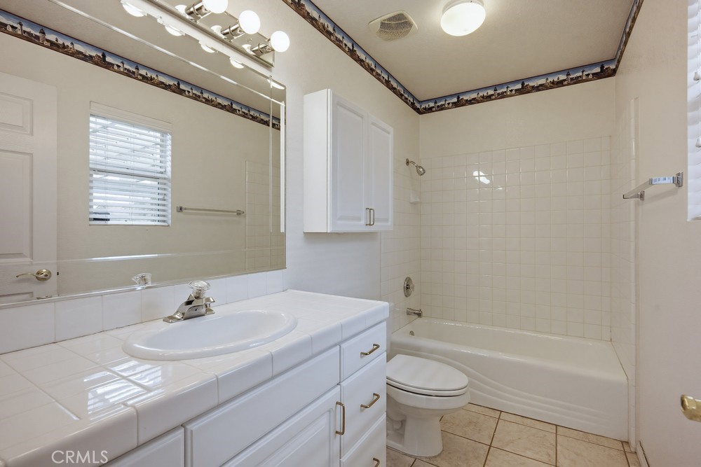 2998 Elder Way Hemet, CA 92545 - Photo 14 of 28 a bathroom with a sink toilet and shower