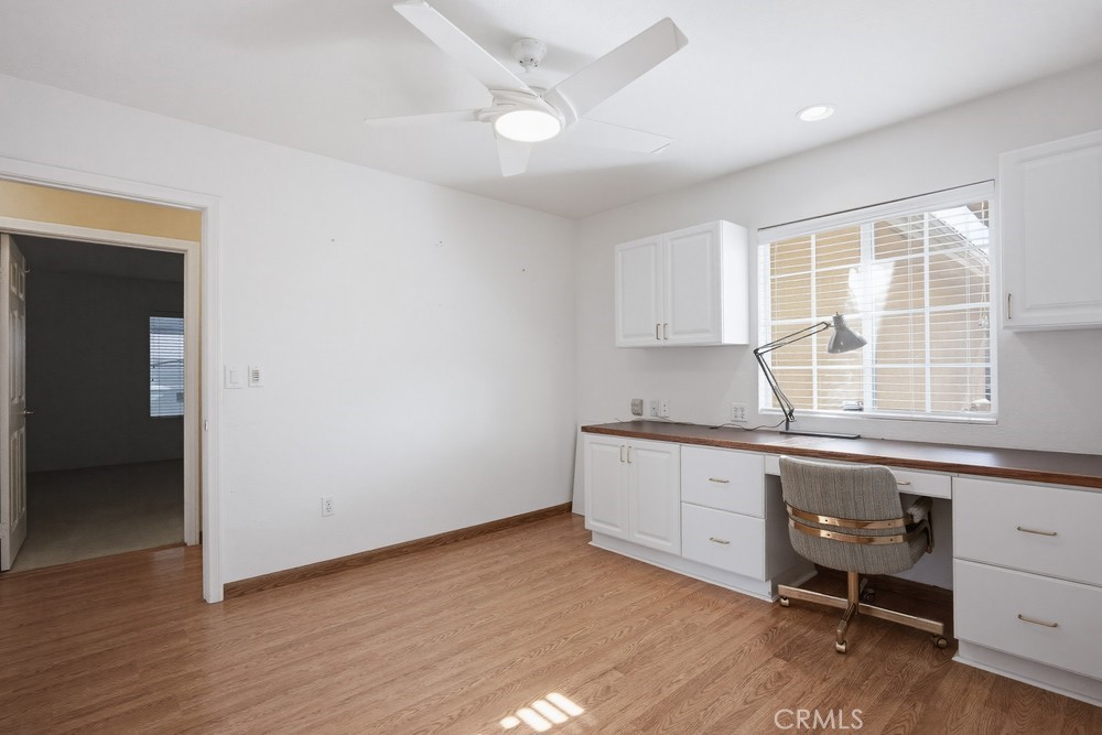 2998 Elder Way Hemet, CA 92545 - Photo 17 of 28 a kitchen with granite countertop white cabinets and white appliances