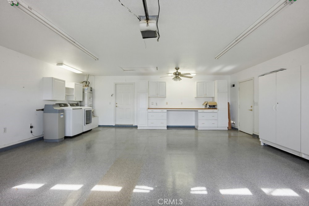 2998 Elder Way Hemet, CA 92545 - Photo 18 of 28 a view of a kitchen with a sink and dishwasher a refrigerator with white cabinets