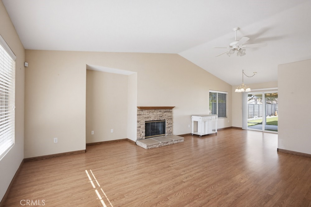 2998 Elder Way Hemet, CA 92545 - Photo 5 of 28 an empty room with windows and fireplace