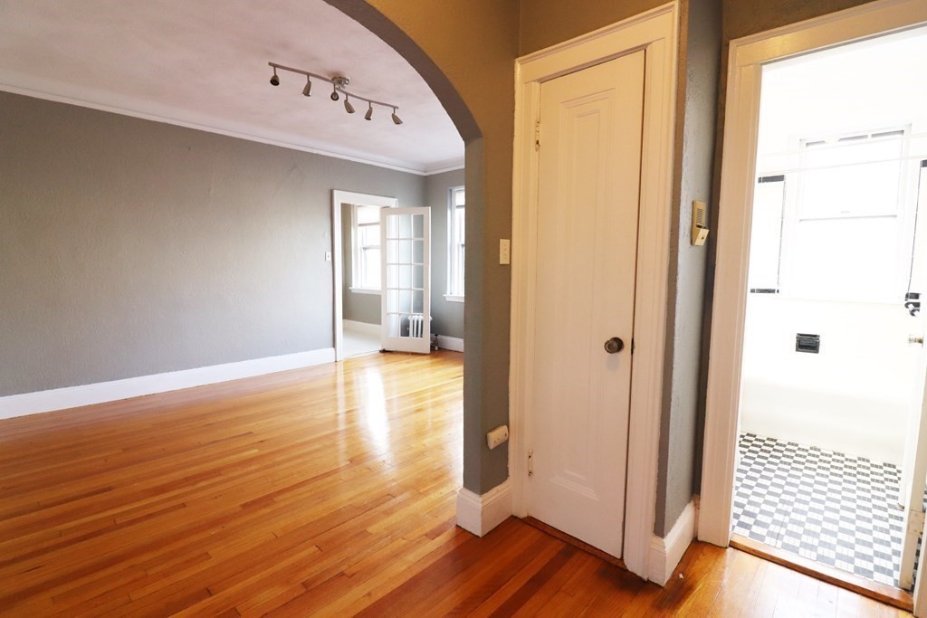 8 Chiswick Road, Unit 36 Boston, MA 02135 - Photo 1 of 16 a view of a hallway with wooden floor