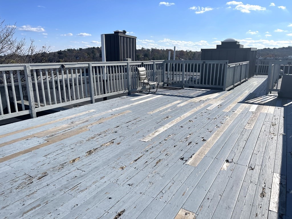 8 Chiswick Road, Unit 36 Boston, MA 02135 - Photo 15 of 16 a view of balcony with wooden floor