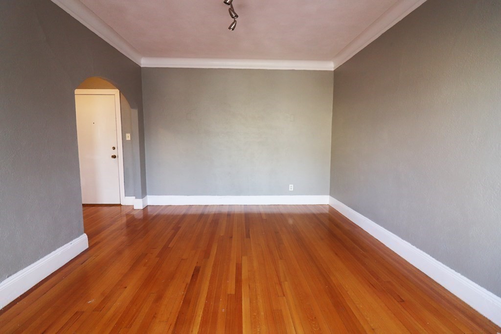 8 Chiswick Road, Unit 36 Boston, MA 02135 - Photo 6 of 16 a view of a room with wooden floor and white walls