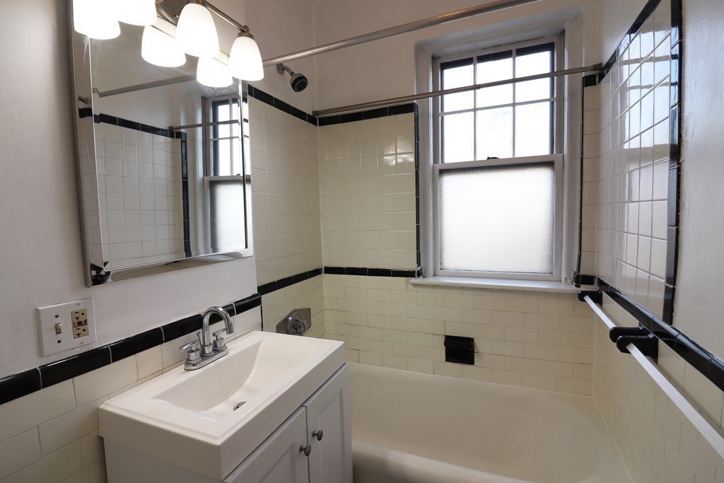 8 Chiswick Road, Unit 36 Boston, MA 02135 - Photo 9 of 16 a bathroom with a sink and a mirror