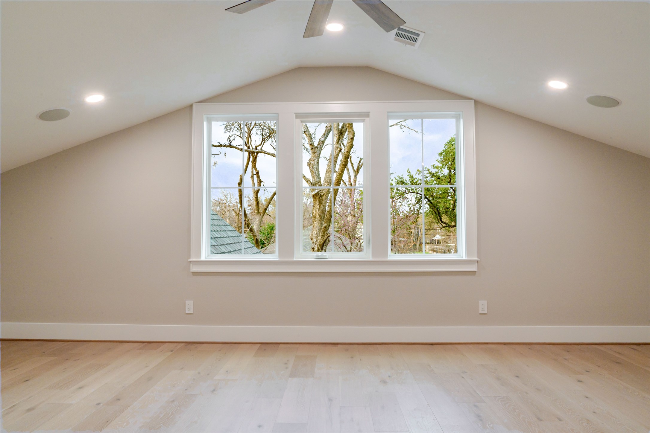 3100 Garwood Street Austin, TX 78702 - Photo 18 of 25 Additional living space featuring light wood-style floors, recessed lighting, and a ceiling fan