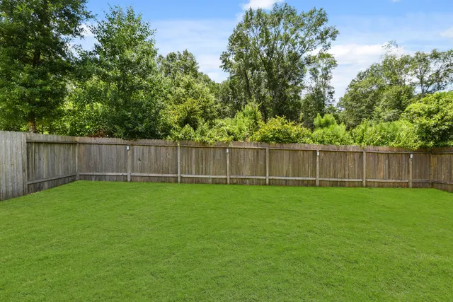 a view of a backyard with green space