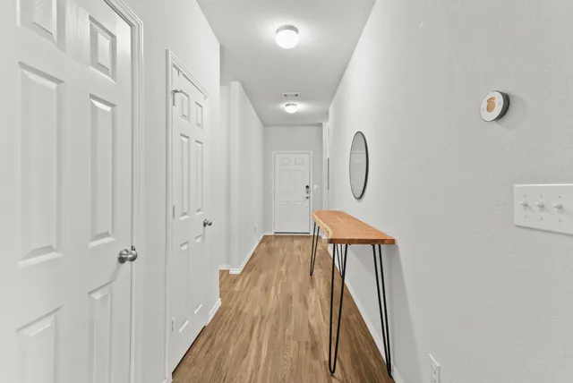 a spacious bathroom with a mirror and shower