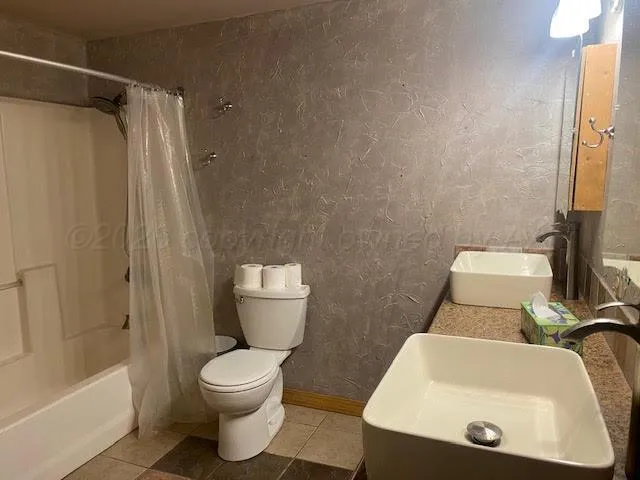 a bathroom with a toilet and a sink