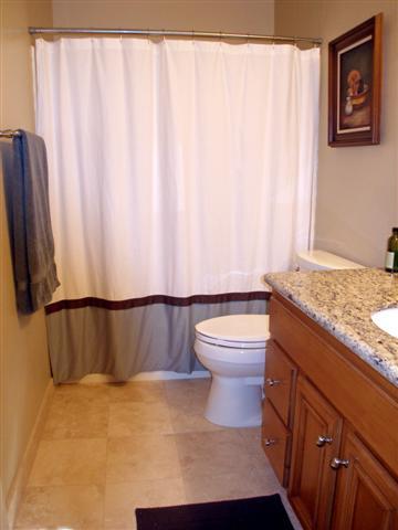 3566 Modoc Road, Unit 36 Santa Barbara, CA 93105 - Photo 13 of 18 a bathroom with a sink a toilet and a shower