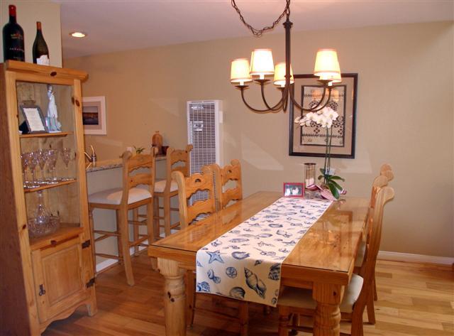 3566 Modoc Road, Unit 36 Santa Barbara, CA 93105 - Photo 8 of 18 a view of a dining room with furniture and wooden floor