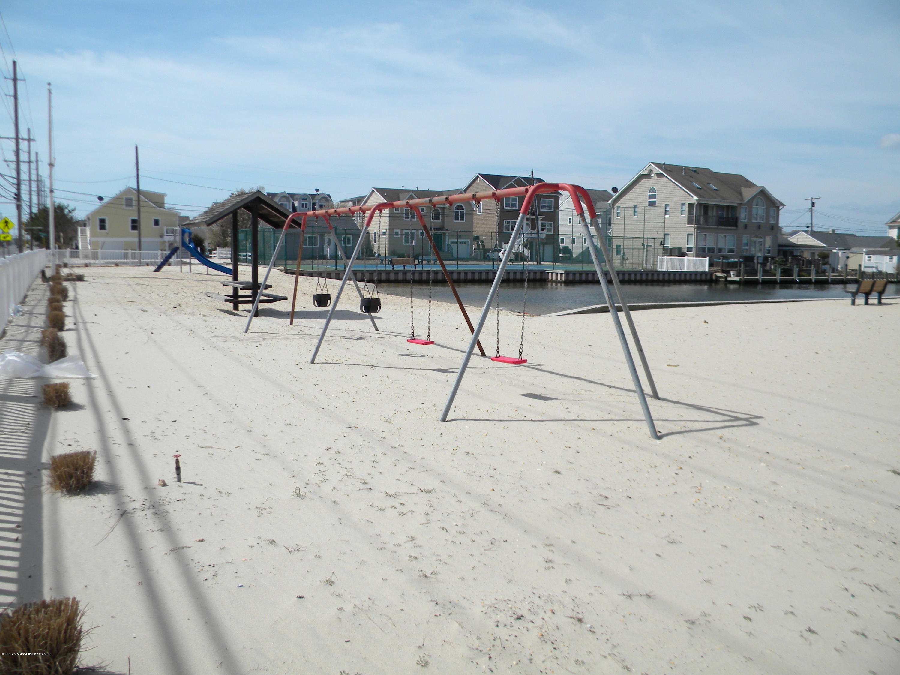 249 Silver Beach Road Lavallette, NJ 08735 - Photo 3 of 49 a view of roof deck with a flat screen tv and outdoor seating