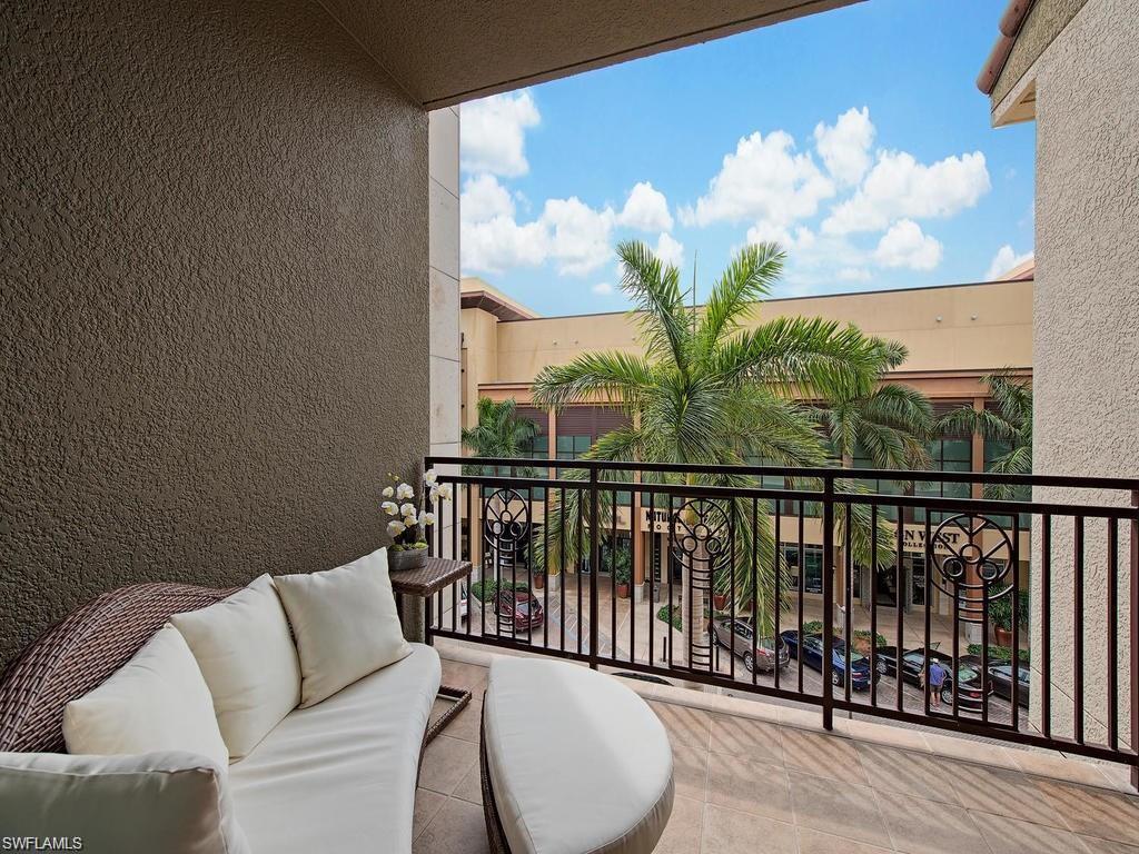 9123 Strada Place, Unit 7306 Naples, FL 34108 - Photo 1 of 19 a view of a balcony with furniture