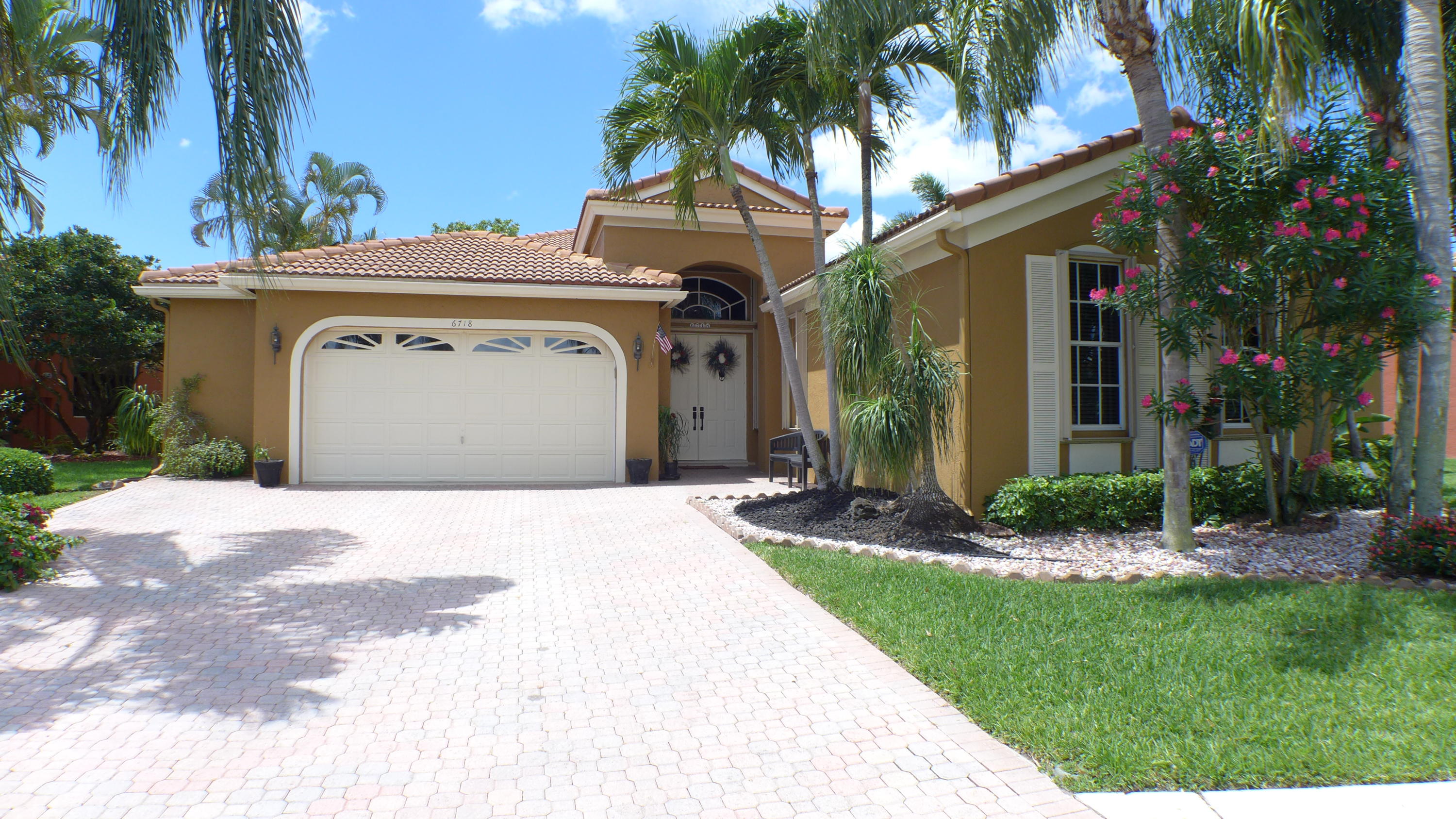 6718 Portside Drive Boca Raton, FL 33496 - Photo 2 of 34 Front Extended garage & Driveway