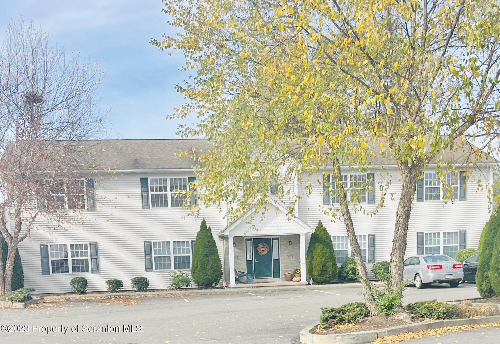 front view of a house with a street