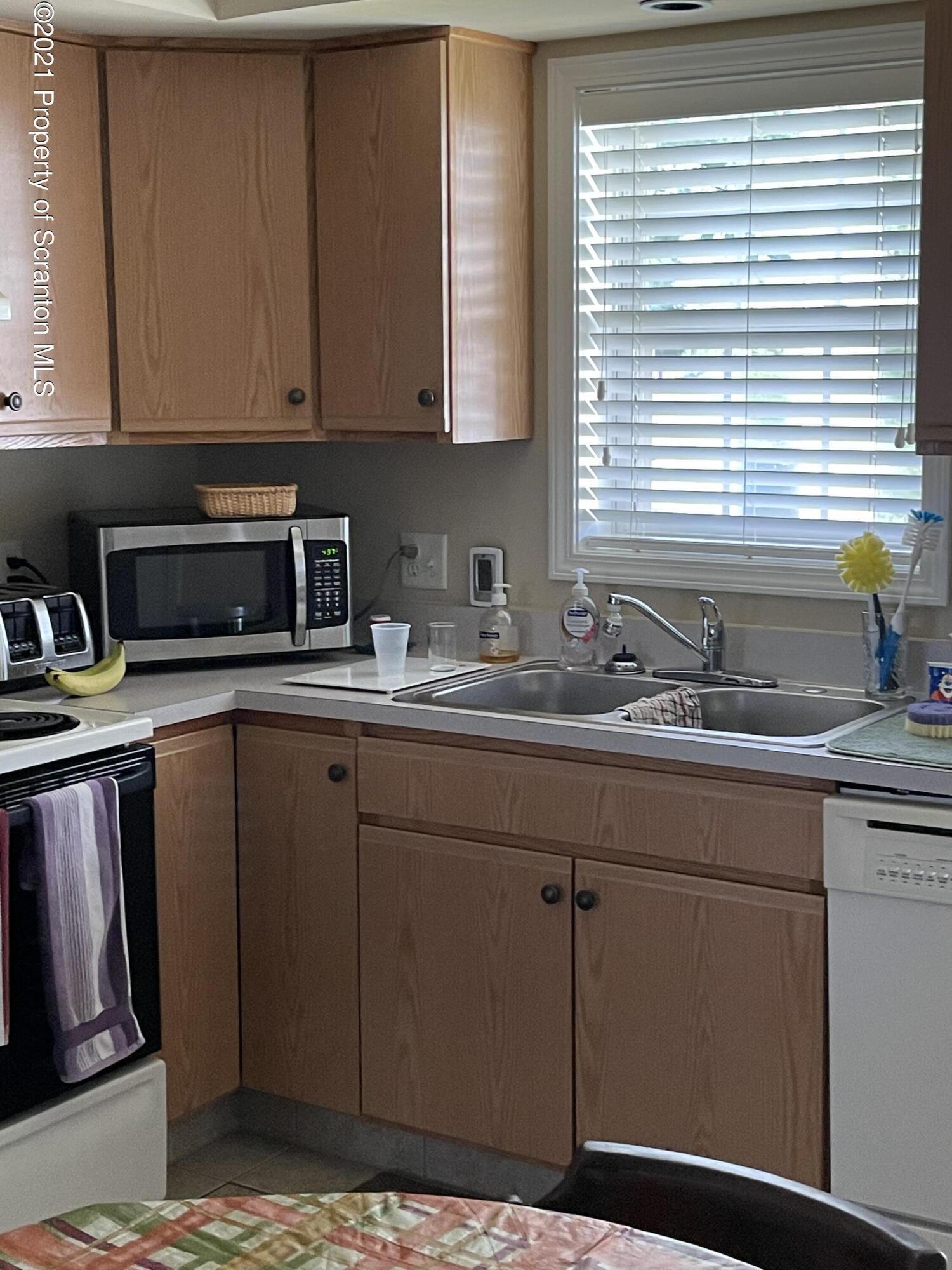 652 Marion Lane Moosic, PA 18507 - Photo 4 of 10 a kitchen with sink and cabinets