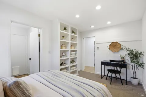 a bedroom with a bed and a dresser