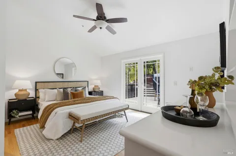 a bedroom with bed and a chandelier