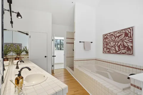 a bathroom with a bathtub and a shower