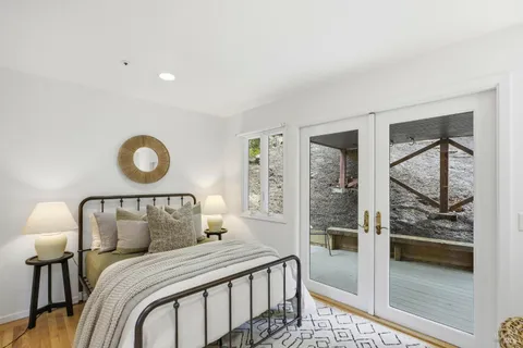 a bedroom with a bed and window