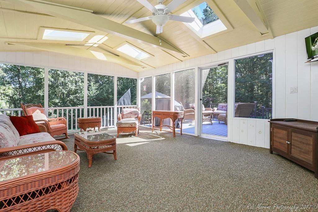 52 Pye Brook Lane Boxford, MA 01921 - Photo 16 of 41 a living room with furniture and a large window