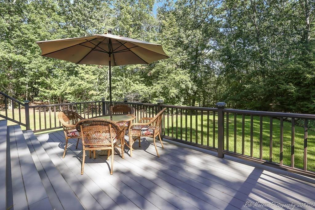 52 Pye Brook Lane Boxford, MA 01921 - Photo 36 of 41 a view of a chairs and table in the balcony