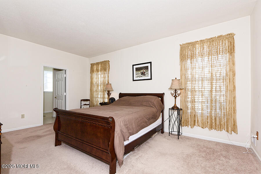 80 Robin Lane Barnegat, NJ 08005 - Photo 19 of 24 a bedroom with a bed and a cabinets