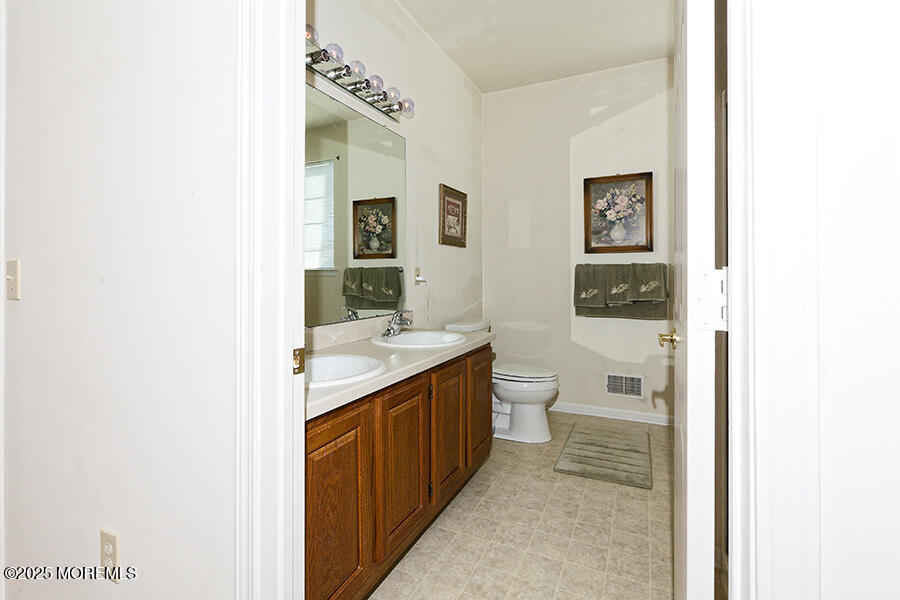 80 Robin Lane Barnegat, NJ 08005 - Photo 21 of 24 a bathroom with a granite countertop sink and a toilet