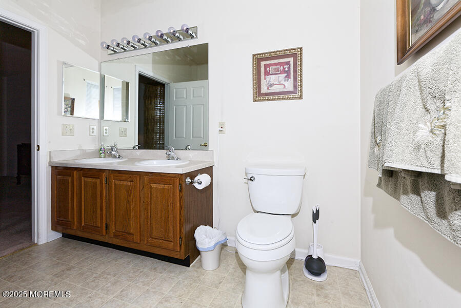 80 Robin Lane Barnegat, NJ 08005 - Photo 22 of 24 a bathroom with a toilet sink and mirror